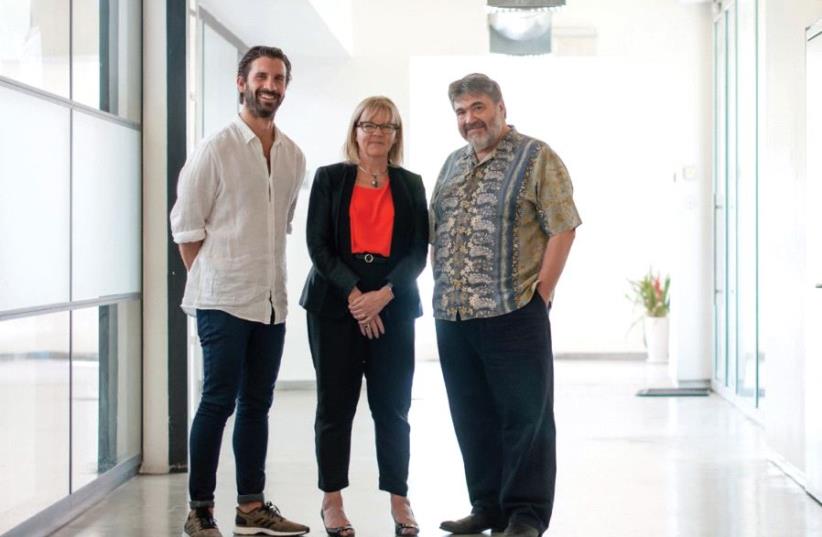 OurCrowd Australia managing director Dan Bennett (left) poses with NAP Private executive general manager Christine Yates and OurCrowd founder Jon Medved (photo credit: YITZ WOOLF)