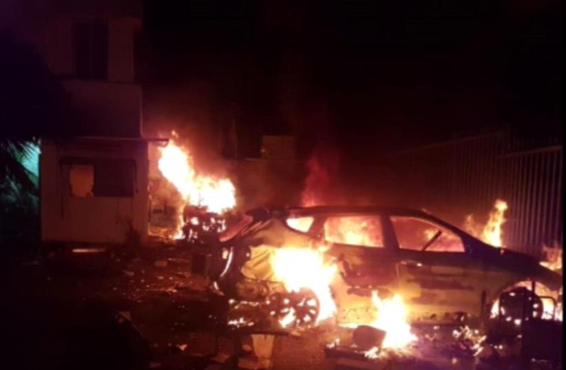 Cars set on fire in a riot in Kafr Kasim. (photo credit: POLICE SPOKESPERSON'S UNIT)