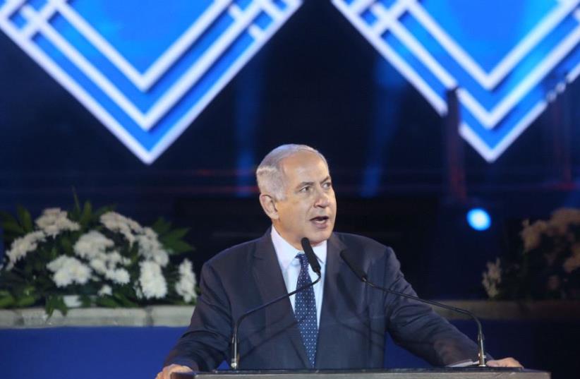 Israeli Prime Minister Benjamin Netanyahu speaks at a memorial ceremony honoring the fallen of Israel's Six Day War in Latrun on Monday June 5, 2017. (photo credit: MARC ISRAEL SELLEM/THE JERUSALEM POST)