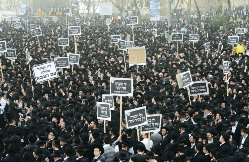 Ultra-orthodox Jews gather for a mass prayer in protest to the government’s army conscription laws in Jerusalem in 2014 (photo credit: KOBI GIDEON/GPO)