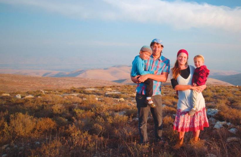 Batya Sela, who is featured in the film, with her family (photo credit: DAVID KIERN)