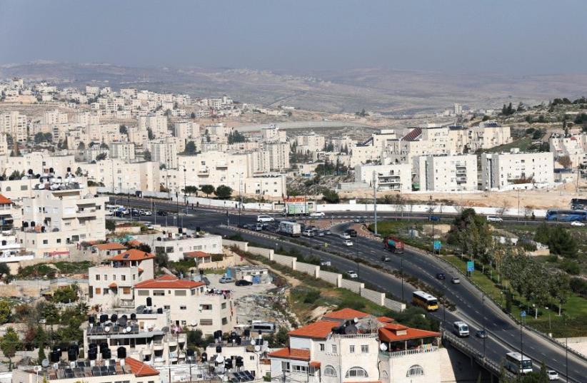 A ROAD RUNS through Pisgat Ze’ev and Beit Hanina in Jerusalem (photo credit: REUTERS)
