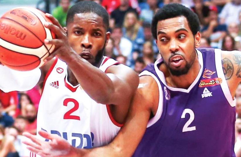Hapoel Jerusalem guard Jerome Dyson (left) scored a game-high 16 points in last night’s 71-60 win over Derwin Kitchen (2) and Ironi Nahariya in the decisive Game 5 of their BSL quarterfinals series. (photo credit: DANNY MARON)
