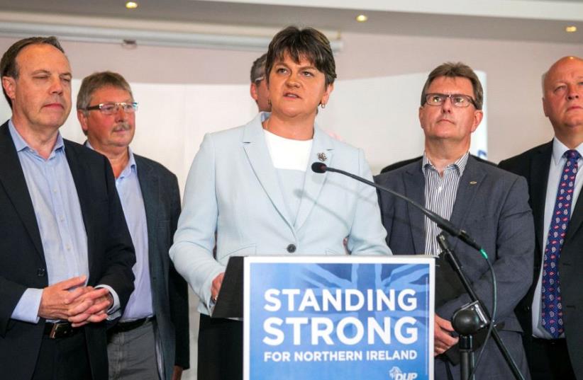 Leader of the Democratic Unionist Party (DUP) Arlene Foster addresses journalists in Belfast. (photo credit: REUTERS)