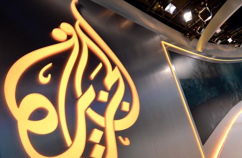 The Al Jazeera logo seen in a studio [Illustrative] (photo credit: AFP / STAN HONDA)