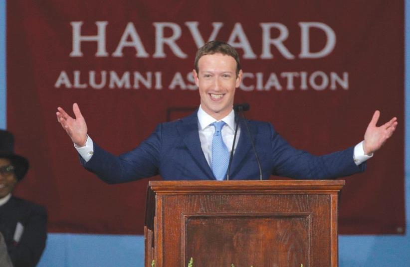 FACEBOOK FOUNDER Mark Zuckerberg speaks during the Alumni Exercises following the 366th Commencement Exercises at Harvard University last month (photo credit: REUTERS)