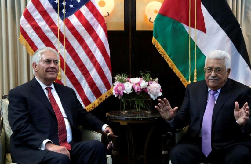 Secretary of State Rex Tillerson meets with Palestinian President Mahmoud Abbas (photo credit: REUTERS/YURI GRIPAS/FILE PHOTO)