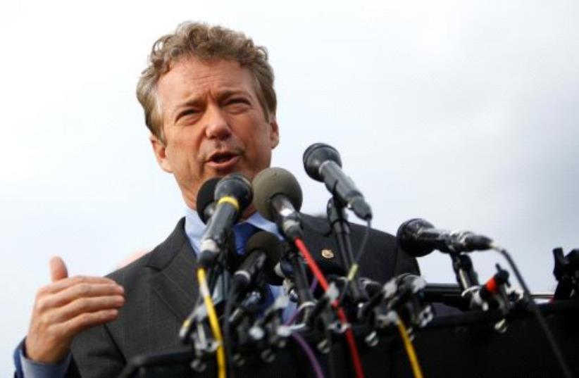 US Senator Rand Paul (R-KY) and other members of the House Freedom Caucus hold a news conference on Capitol Hill in Washington, U.S. March 7, 2017. (photo credit: REUTERS/ERIC THAYER)