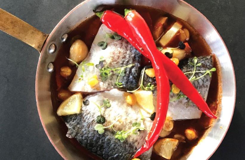 Sea bream chreime in a spicy tomato sauce with pickled lemons and crispy chickpeas (photo credit: AVITAL GINSBERG)