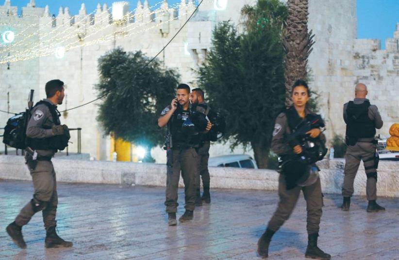 Boder Police officers secure the area around Jerusalem’s Damascus Gate after the terrorist attack on Friday evening, which killed St.-Sgt.-Maj. Hadas Malka (photo credit: AMMAR AWAD / REUTERS)