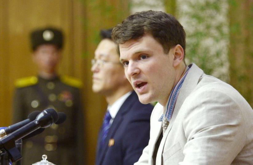 FILE PHOTO - Otto Frederick Warmbier attends a news conference in Pyongyang, North Korea, in this photo released by Kyodo February 29, 2016.  (photo credit: KYODO/VIA REUTERS)