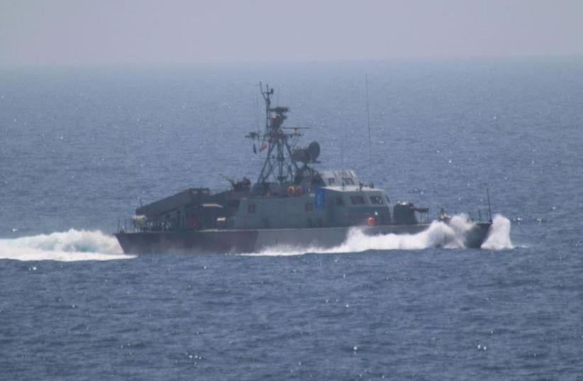 File: Military vessels from Iran's Revolutionary Guard Corps at the Strait of Hormuz (photo credit: REUTERS)