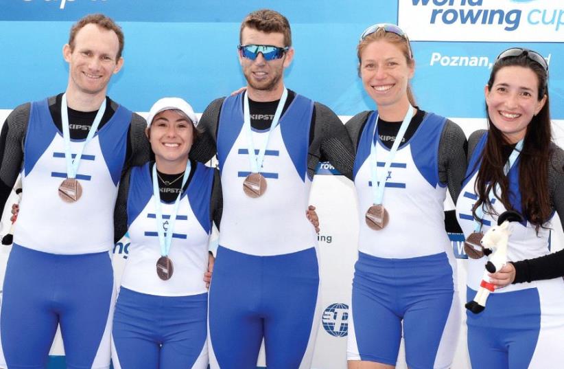 The memberS of Israel’s Paralympic mixed coxed four rowing team (from left) Barak Hazor, Leah Sass, Achiya Klein, Simona Goren and Shay-Lee Mizrahi pose with their medals after finishing in third place at the World Cup event in Poznan. (photo credit: DETLEV SAYEV)