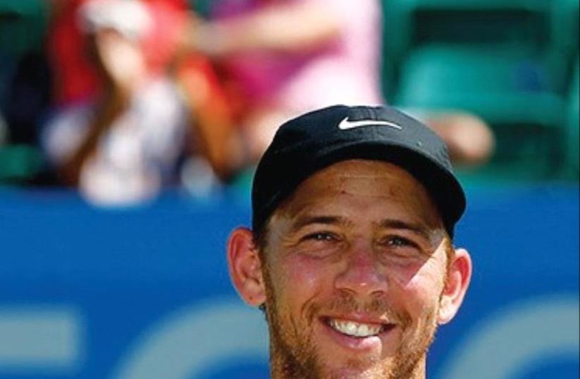 Dudi Sela poses with his trophy yesterday after winning the ATP Challenger Tour title in Nottingham, England. (photo credit: ATP CHALLENGER TOUR)