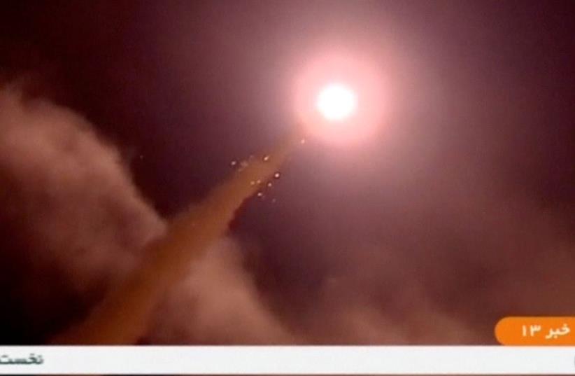 A still image taken from footage shot on June 18, 2017 and broadcast on Iranian Television IRINN, purports to show missiles being fired from Iran into eastern Syria. (photo credit: IRINN VIA REUTERS TV)