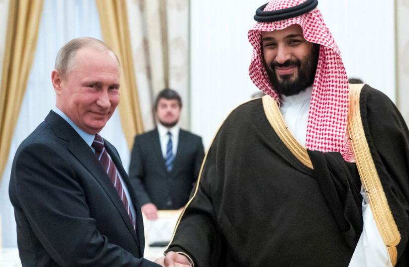 Russian President Vladimir Putin shakes hands with Saudi Deputy Crown Prince and Defence Minister Mohammed bin Salman during a meeting at the Kremlin in Moscow, Russia (photo credit: REUTERS/PAVEL GOLOVKIN/POOL)