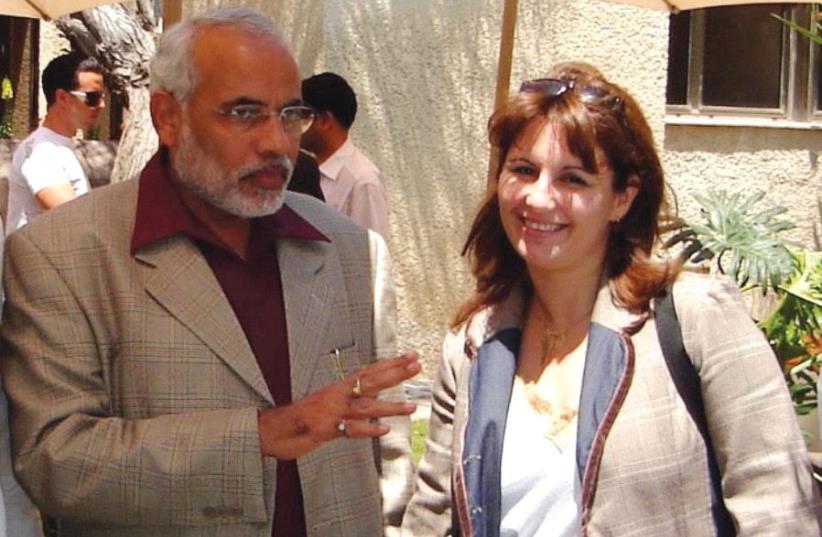ANAT BERNSTEIN-REICH, head of the Israel-India Chamber of Commerce and managing director of A&G Partners, chats with Narendra Modi, then chief minister of Gujarat state, during his visit to Israel in 2006. (photo credit: Courtesy)