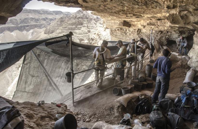 Volunteers at work in the archeological excavation of the cave (photo credit: YOLI SHWARTZ ISRAEL ANTIQUITIES AUTHORITY)