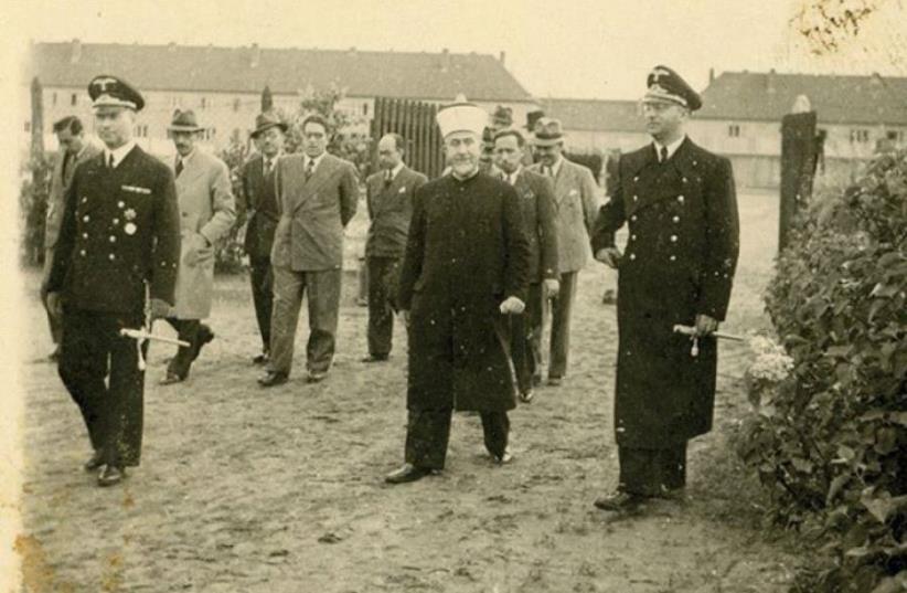 Haj Amin al-Husseini pictured visiting an unnamed German camp during World War II.  (photo credit: KEDEM AUCTION HOUSE)
