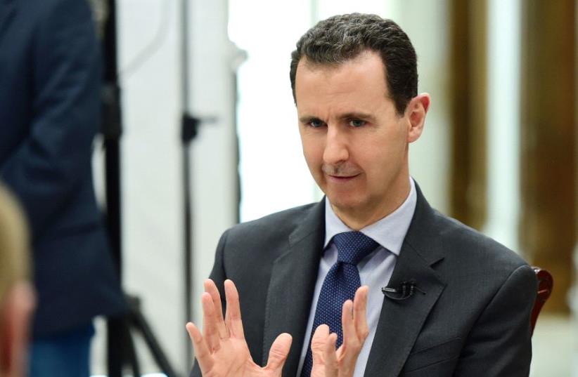 Syria's President Bashar al-Assad speaks during an interview with RIA Novosti and Sputnik in this handout picture provided by SANA on April 21, 2017. (photo credit: REUTERS)