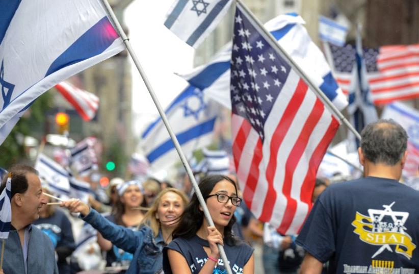 People participate in the "Celebrate Israel" parade along 5th Ave. in New York City, US, June 4, 2017.  (photo credit: REUTERS/STEPHANIE KEITH)