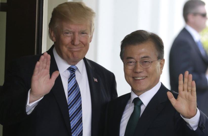US President Donald Trump welcomes South Korean President Moon Jae-in at the White House in Washington, June 30, 2017 (photo credit: JIM BOURG / REUTERS)