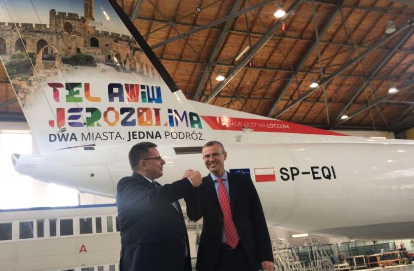 Tourism Minister Yariv Levin with Lot Airlines CEO Rafal Milczarski at the launch of the branded aircraft in Poland (photo credit: PETER NOVITSKI)