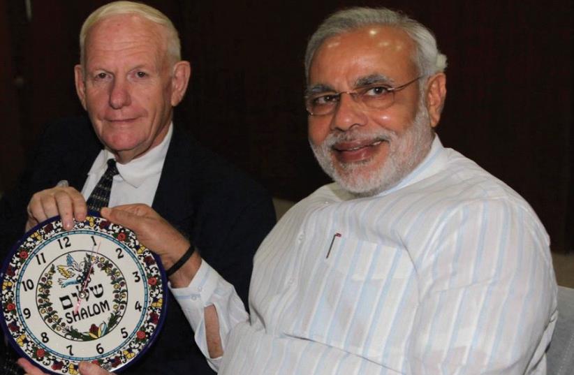 AMNON OFEN, director of NaanDanJain Irrigation, presents a clock to Narendra Modi in 2013 when he was chief minister of Gujarat. (photo credit: Courtesy)