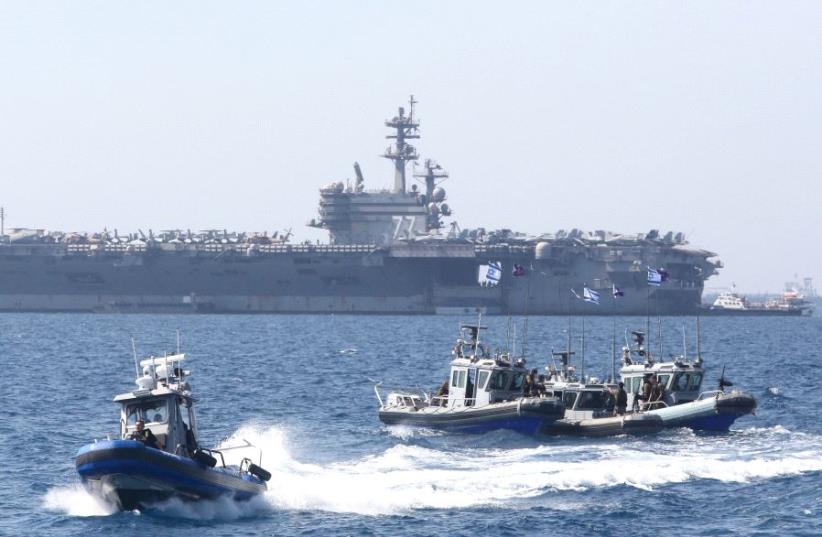 The USS George H.W. Bush docked near northern Israel's Haifa Port, July 3, 2017 (photo credit: MARC ISRAEL SELLEM/THE JERUSALEM POST)