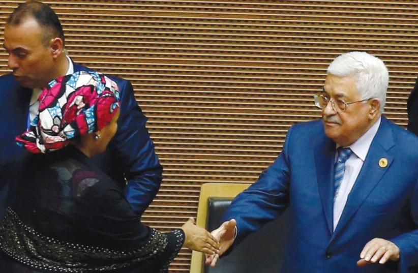 PALESTINIAN AUTHORITY President Mahmoud Abbas (right) is welcomed by UN Deputy Secretary-General Amina Mohammed at African Union headquarters in Addis Ababa yesterday (photo credit: REUTERS)