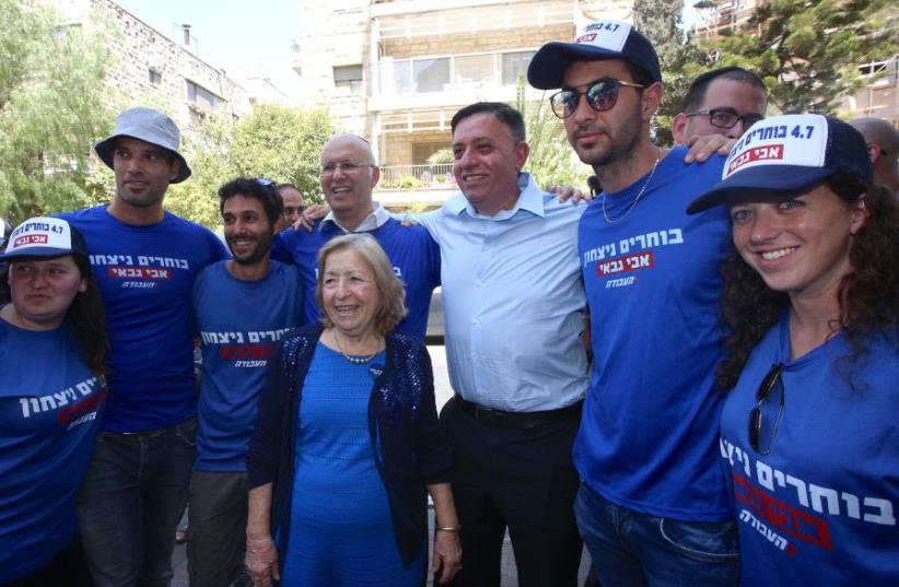 Avi Gabbay and supporters at the Labor primary election, July 4 2017. (photo credit: MARC ISRAEL SELLEM/THE JERUSALEM POST)