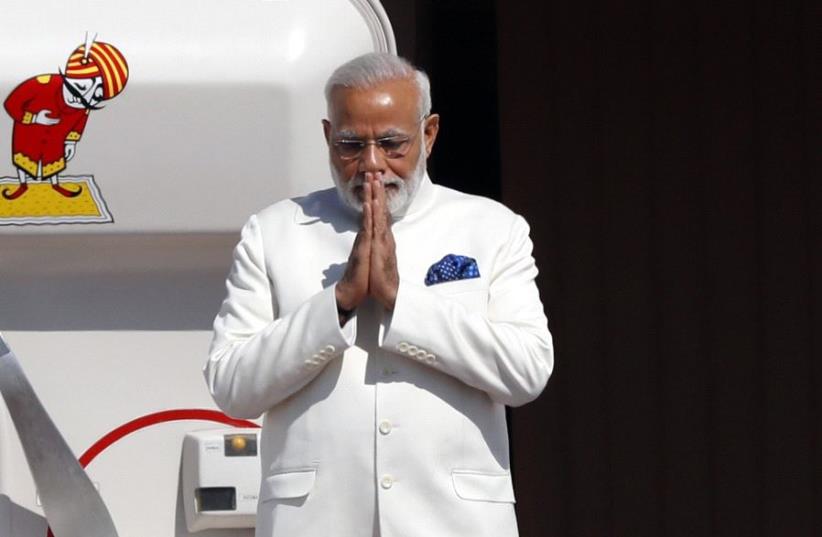 ndian Prime Minister Narendra Modi gestures as he disembarks from his plane upon his arrival at Ben-Gurion International airport near Tel Aviv on July 4, 2017 (photo credit: JACK GUEZ / AFP)