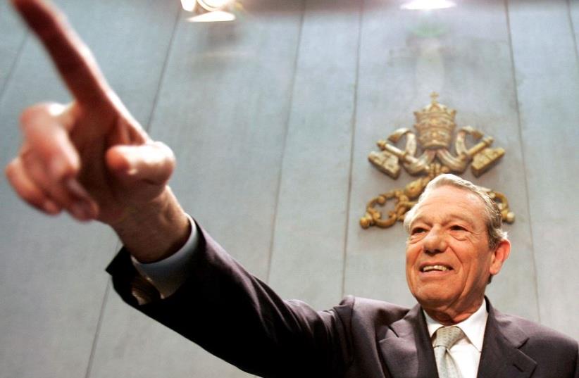The Pope's official spokesman Joaquin Navarro-Valls gestures during a news conference in the Holy See press office at the Vatican February 10, 2005.  (photo credit: REUTERS)