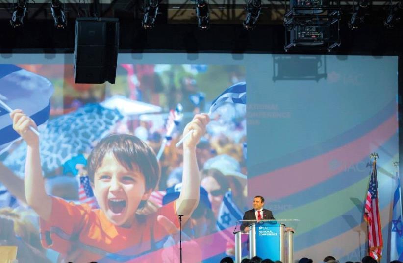 Shoham Nicolet, CEO of the Israel American Council, speaks at one of the many events held during the Israel parade in New York City last month (photo credit: IAC)