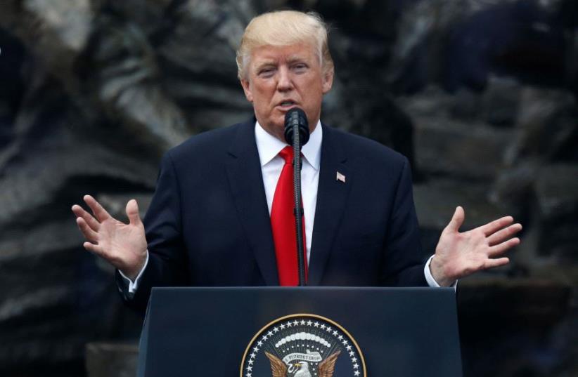 US.President Donald Trump gestures as he gives a public speech at Krasinski Square in Warsaw, Poland July 6, 2017 (photo credit: REUTERS)