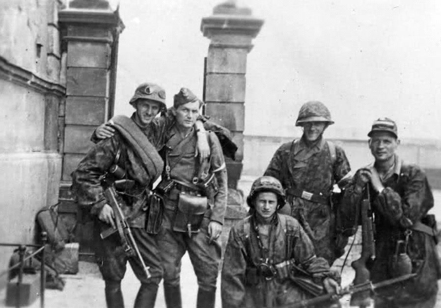 Home Army soldiers from Kolegium 'A' of Kedyw formation on Stawki Street in the Wola District of Warsaw, September 1944 (photo credit: Juliusz Bogdan Deczkowski - Public Domain)