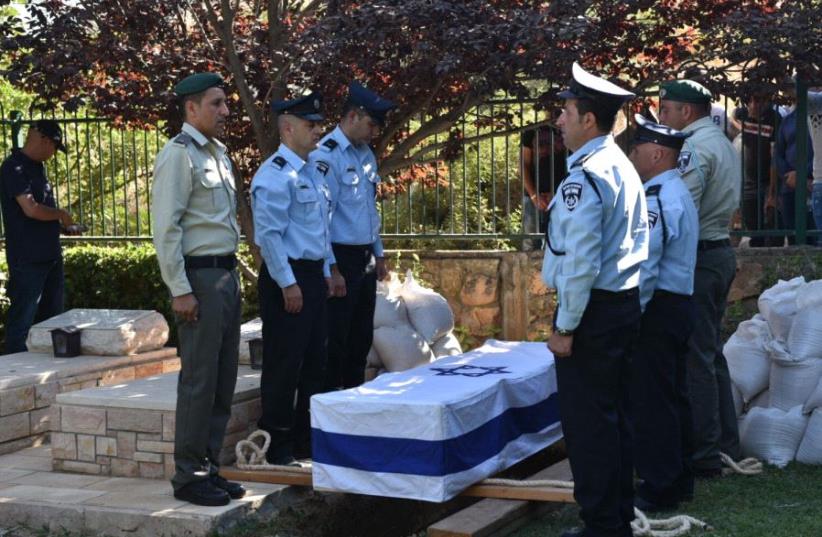 Hail Stawi, killed in a terrorist attack on the Temple Mount, is buried in the village of Maghar, July 14, 2017. (photo credit: ISRAEL POLICE)