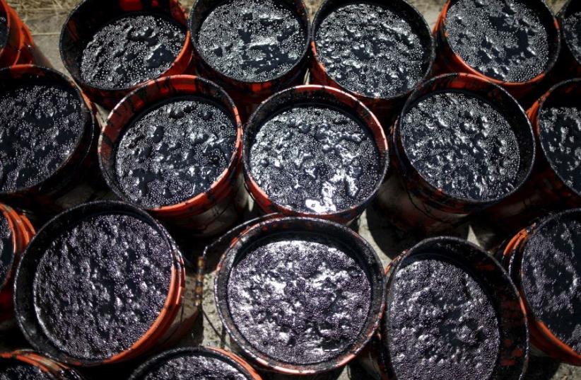 Buckets of oil (photo credit: REUTERS)
