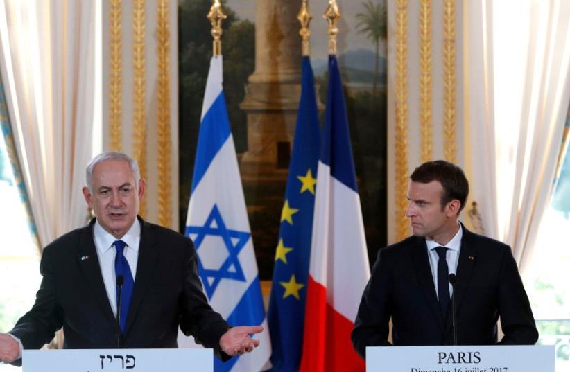 French President Emmanuel Macron and Israeli Prime Minister Benjamin Netanyahu attend a news conference to make a joint declaration at the Elysee Palace in Paris, France, July 16, 2017. (photo credit: REUTERS/STEPHANE MAHE)