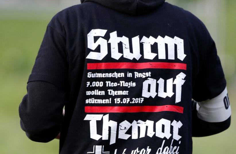 Attendee at Neo-Nazi concert, Themar, Germany, July 2017 (photo credit: REUTERS/MICHAELA REHLE)