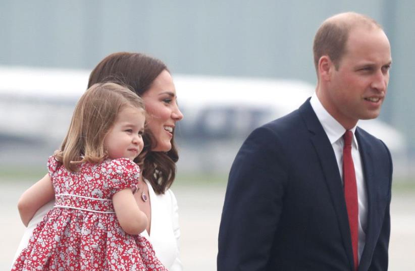 Prince William, the Duke of Cambridge, his wife Catherine, The Duchess of Cambridge and Princess Charlotte arrive at a military airport in Warsaw, Poland July 17, 2017 (photo credit: REUTERS)