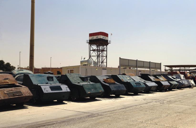 SPOILS OF war. Islamic State vehicles captured by the Iraqi army. (photo credit: REUTERS)