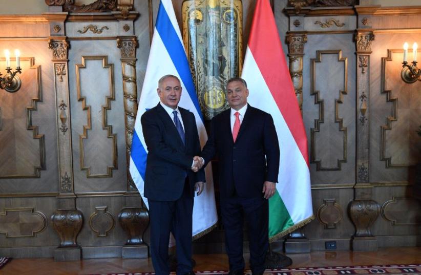Netanyahu and Orban (photo credit: CHAIM ZACH / GPO)