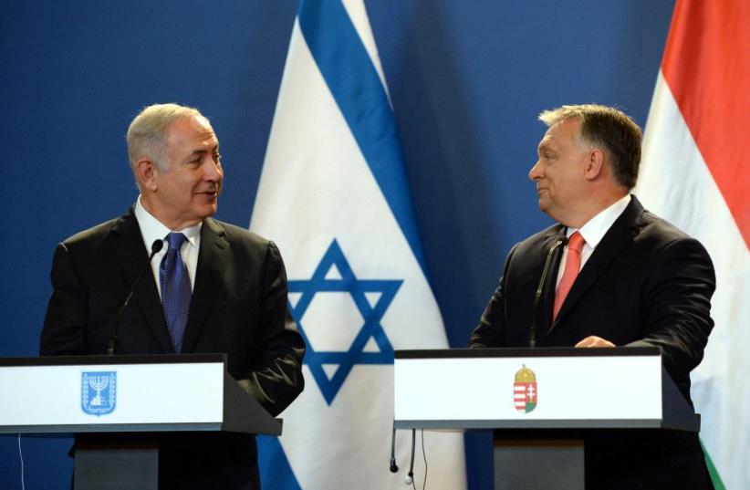 Netanyahu and Orban (photo credit: CHAIM ZACH / GPO)