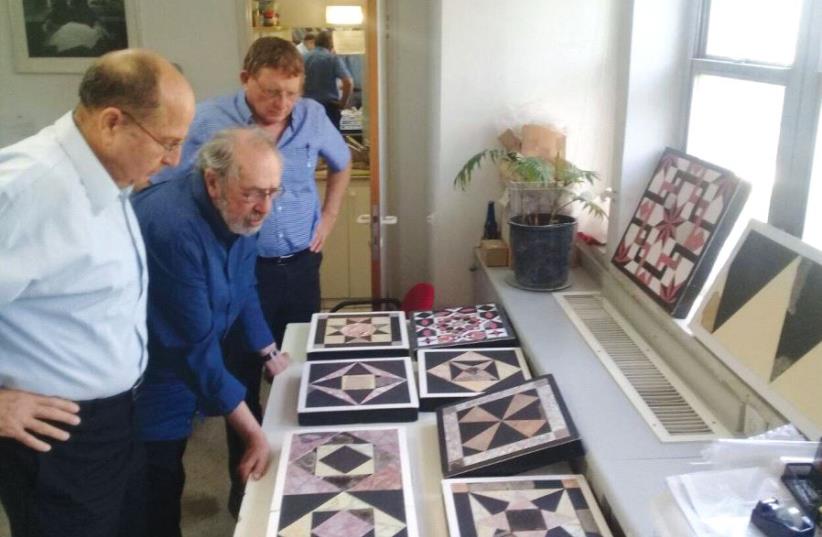Archeologist Dr. Gabriel Barkay (center) inspects Second Temple-era ‘opus sectile’ floor tiles from the Temple Mount, in the presence of Moshe Ya’alon (right) (photo credit: FACEBOOK)