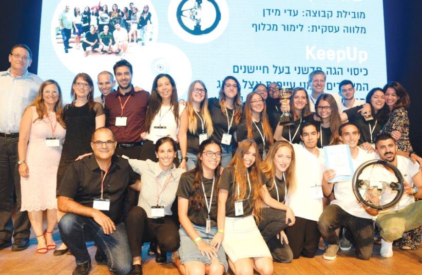  Netanya’s ‘Keep Up’ start-up team poses with Batsheva Moshe and Rony and Yael Zarom (photo credit: KOBI KONAKS)