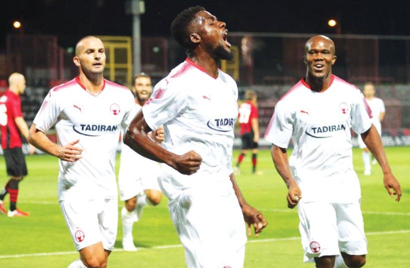 Hapoel Beersheba could use another scoring contribution from midfielder John Ogu (center) tonight, with striker Ben Sahar (left) among several attacking players to miss the first leg of the Champions League third qualifying round match against Bulgaria’s Ludogorets Razgrad. (photo credit: UDI ZITIAT)