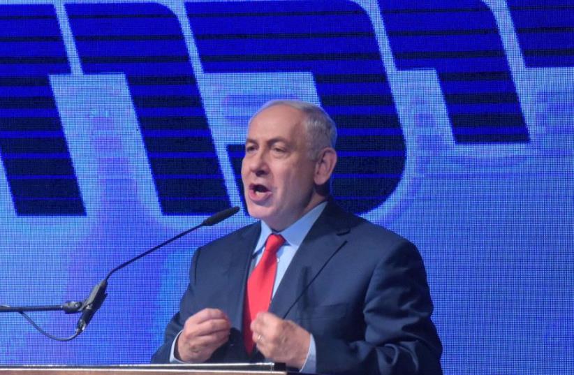 Prime Minister Benjamin Netanyahu speaks at a rally. (photo credit: AVSHALOM SASSONI/MAARIV)