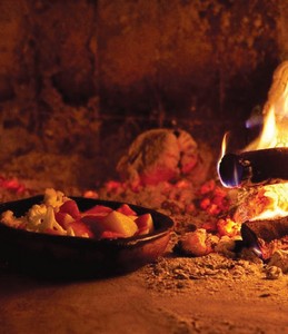 Baked vegetables cooking in the taboon