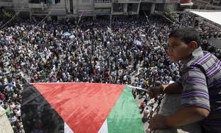 Palestinian boy looks over rally in Ramallah -Photo REUTERS/Darren Whiteside